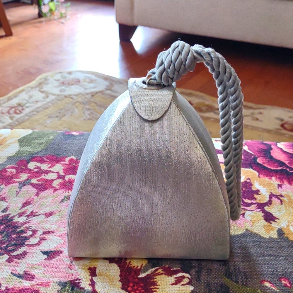 Super Cute New Silver Glistening Wrist Bag. Pair with jeans and black blazer.
